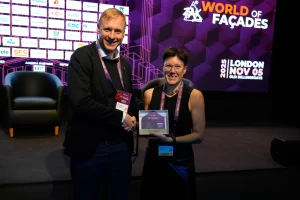 Speakers with a ZAK World of Facades award plaque naming Thomas Henriksen of Henriksen Studio, London, November 2025