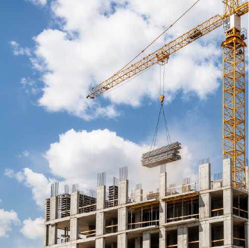 AESG construction-crane-lifting-materials-building-site