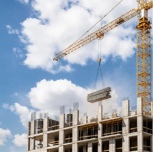 AESG construction-crane-lifting-materials-building-site