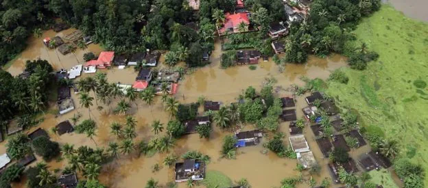 An aerial view of partially submerged houses in Kerala, India The unusual downpour caused rivers in the st