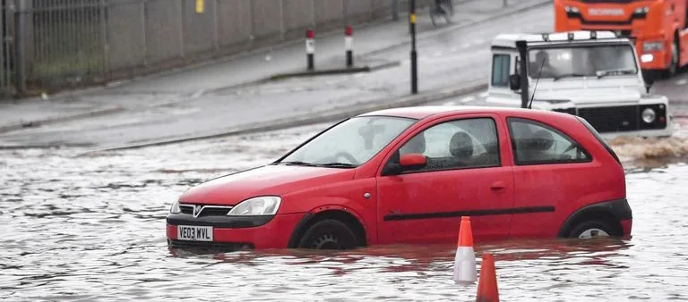 Abandoned car in Birmingham city center due to flooding Another major impact observed due to global warming